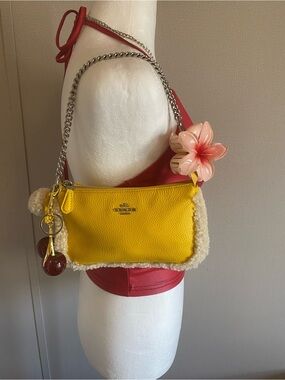 Yellow Coach mini hand bag with white fur trim